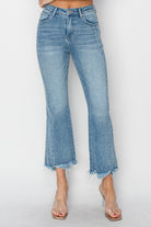 Risen Betina High Rise Ankle Flare Jeans with step hem detail in light wash denim.