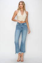 Risen Betina high rise step hem ankle flare jeans paired with a stylish cropped top, perfect for spring and summer.