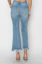 Back view of women's Risen Betina high rise step hem detail ankle flare jeans, perfect for spring and summer.