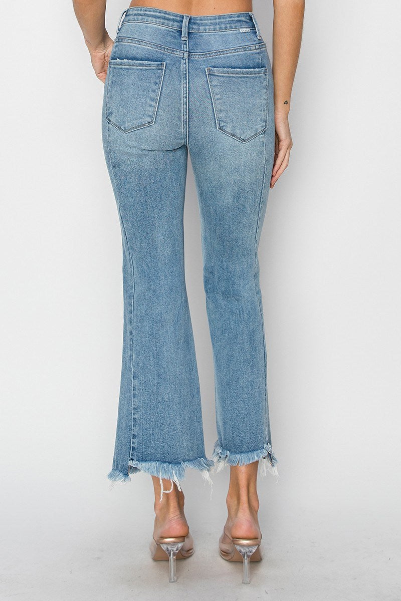 Back view of women's Risen Betina high rise step hem detail ankle flare jeans, perfect for spring and summer.