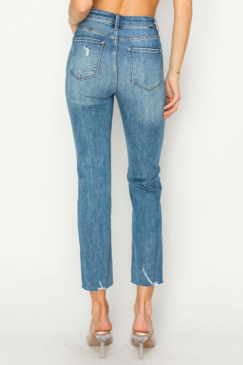 Back view of Risen Celeste high-rise distressed slim straight jeans, showcasing a sleek fit and modern style.