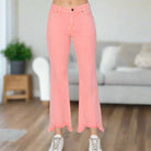 Sierra Sky Jeans in playful flamingo pink with frayed hems, perfect for adding personality to any outfit.
