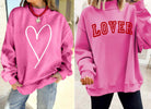 DOUBLE THE LOVE REVERSIBLE PULLOVER showcasing bold heart and LOVER graphics in bright pink.