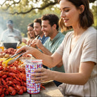 LET THE GOOD TIMES BOIL - 22 OZ TRAVEL MUG - Swig used at a festive outdoor gathering with food and friends.