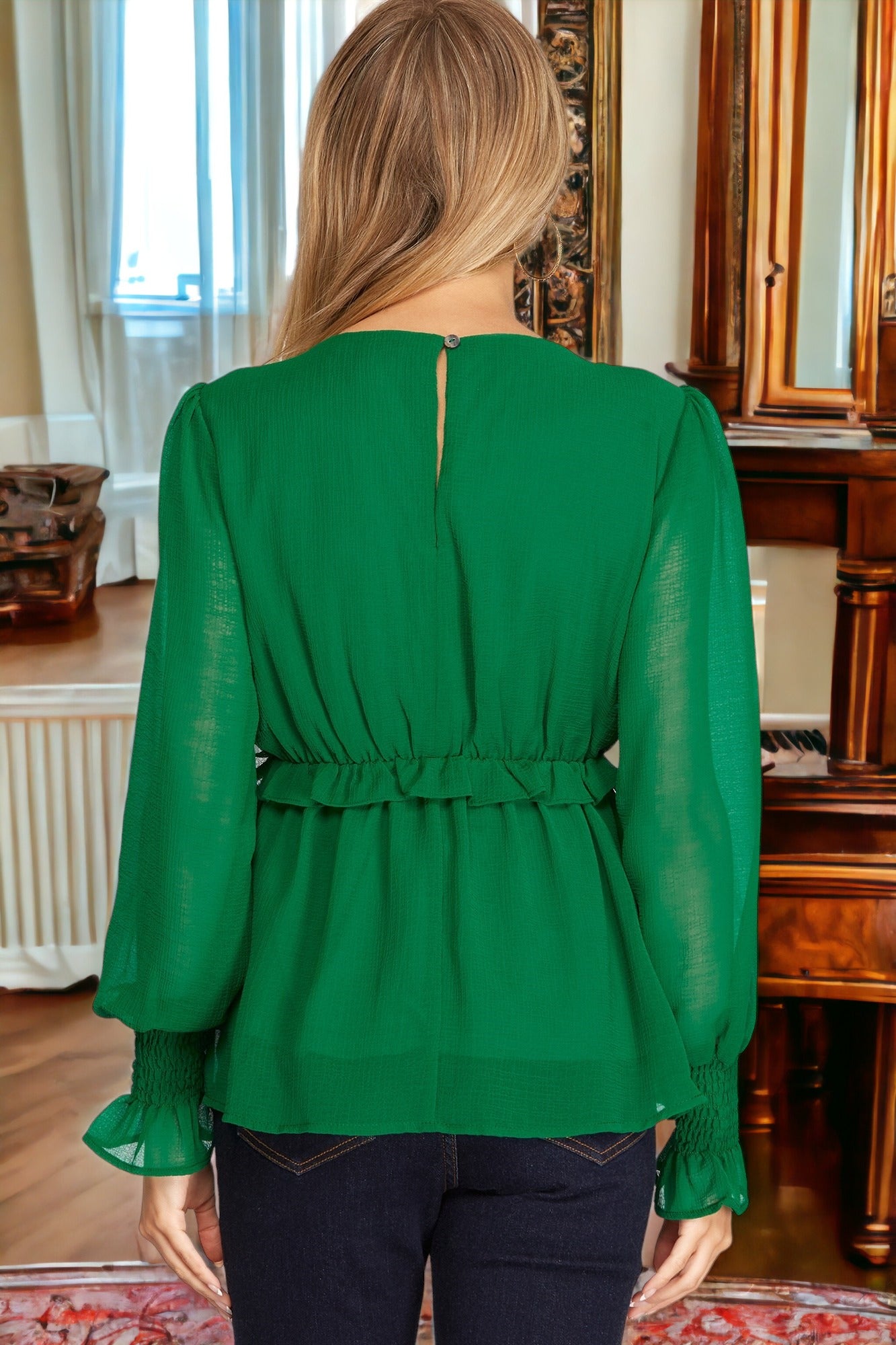 EMERALD TREASURE Top by SHE+SKY $10.00 A versatile top that transitions effortlessly from work to parties to dining out. The EMERALD TREASURE Top features a flattering v-neck, shirred cuffs, and an empire waist with a delicate ruffle. The sheer sleeves an