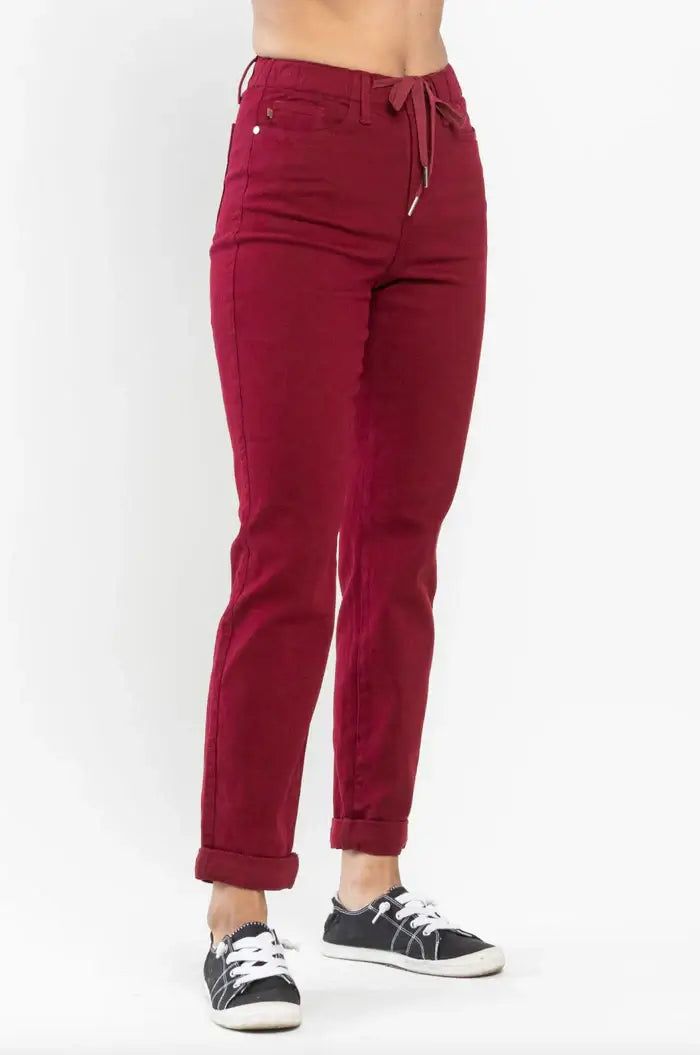 Crimson Judy Blue Bridget Joggers with drawstring waistband and 4-way stretch, featuring a modern high-rise fit on a casual outfit.