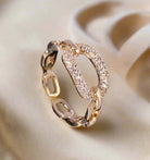 Elegant gold tone adjustable ring with rhinestone embellishments, showcasing exquisite design and beauty.