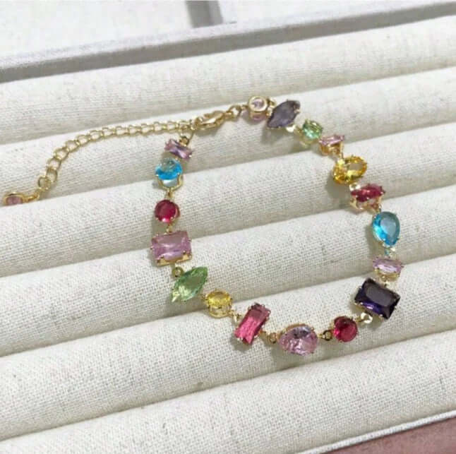 Vibrant Gemstone Cascade Bracelet in gold tone featuring colorful cubic zirconia gems, elegant and luxurious design.