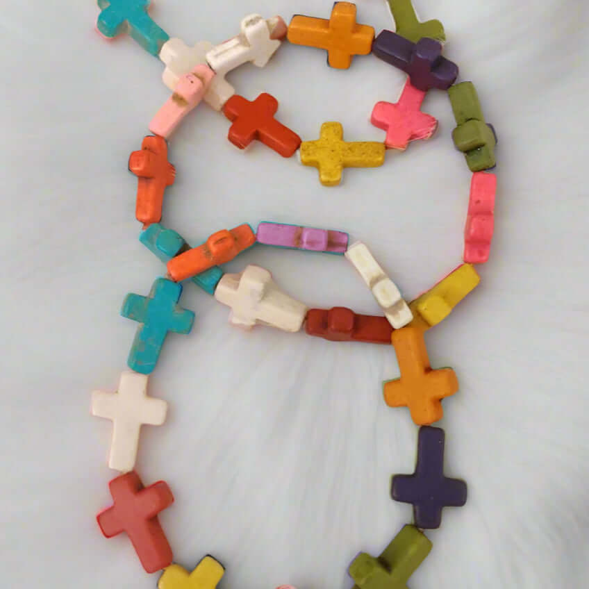 Handmade Coat of Many Colors Bracelet featuring colorful wooden cross beads on a stretchy band.
