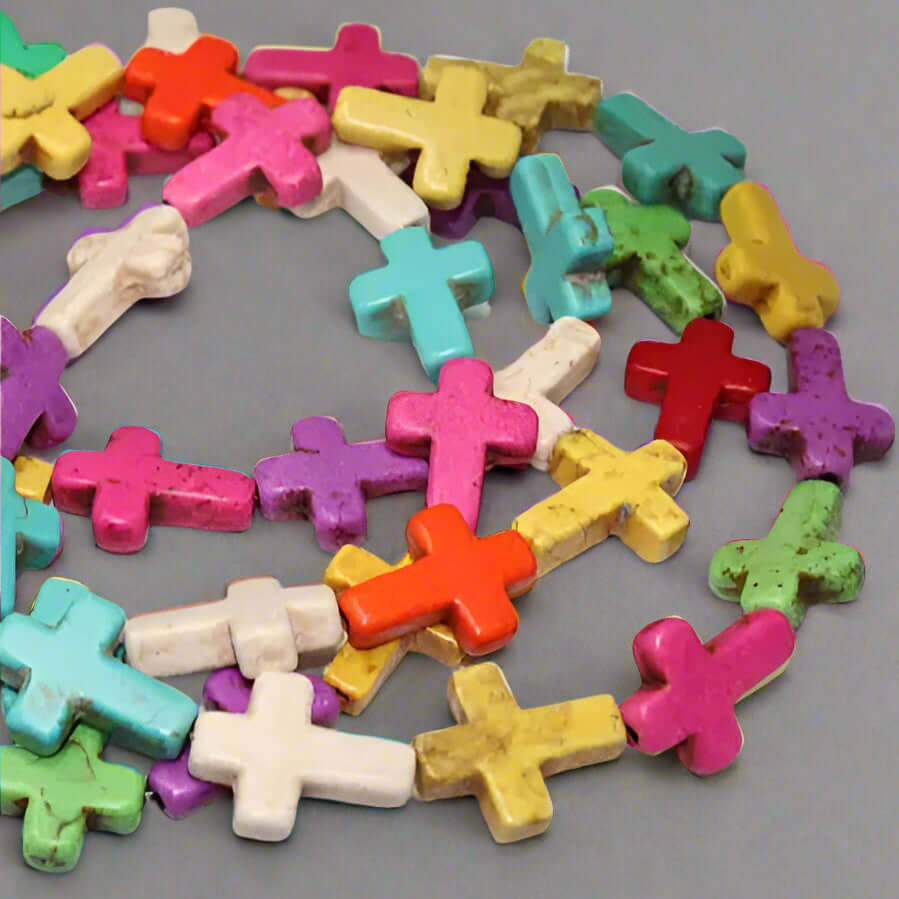 Colorful wooden cross beads featuring a variety of hues and shapes, ideal for a joyful bracelet design.