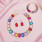 CANDY CONFETTI JEWELRY SET featuring colorful rhinestones in a vibrant, eye-catching design on a silky background.