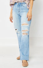 Raine jeans by Judy Blue, featuring a trendy distressed look and straight-leg fit in light wash denim.