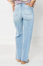 Back view of Judy Blue Raine straight-leg jeans in light blue, showcasing a versatile 90s-inspired style.