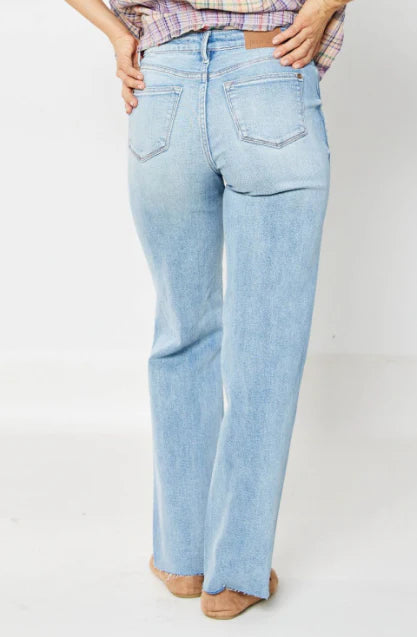 Back view of Judy Blue Raine straight-leg jeans in light blue, showcasing a versatile 90s-inspired style.