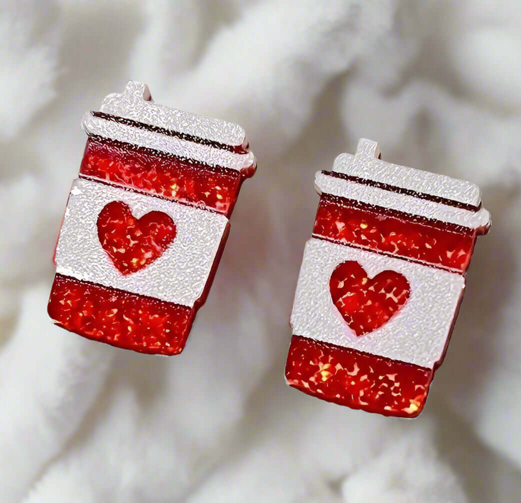 Acrylic stud earrings shaped like coffee cups with red accents and heart design, perfect for coffee lovers.
