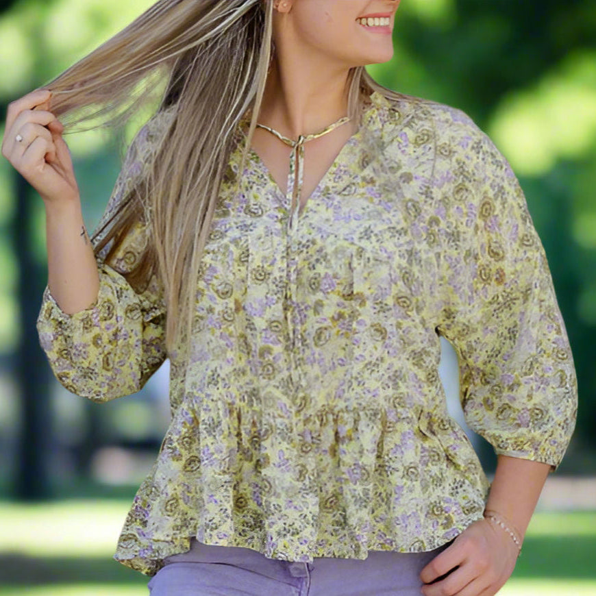 Golden Hour Garden Top by Umgee in soft lavender and yellow floral print, featuring a ruffled neckline and peplum hem.