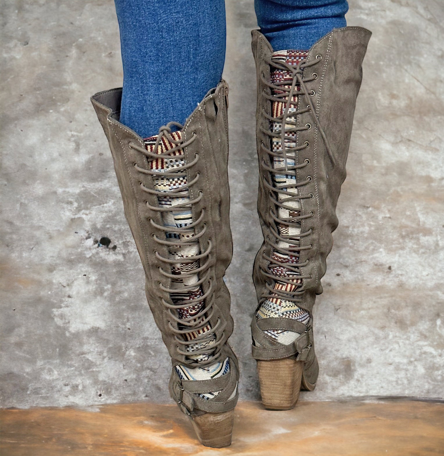 ROMERO BOOTS BY VERY G in BROWN by Very G $36.00 The luxurious allure of these brown suede boots is undeniable; an exquisite Aztec pattern laces up the back, while the supple suede provides an effortless fit. Added to this, the wood block heel promises ul