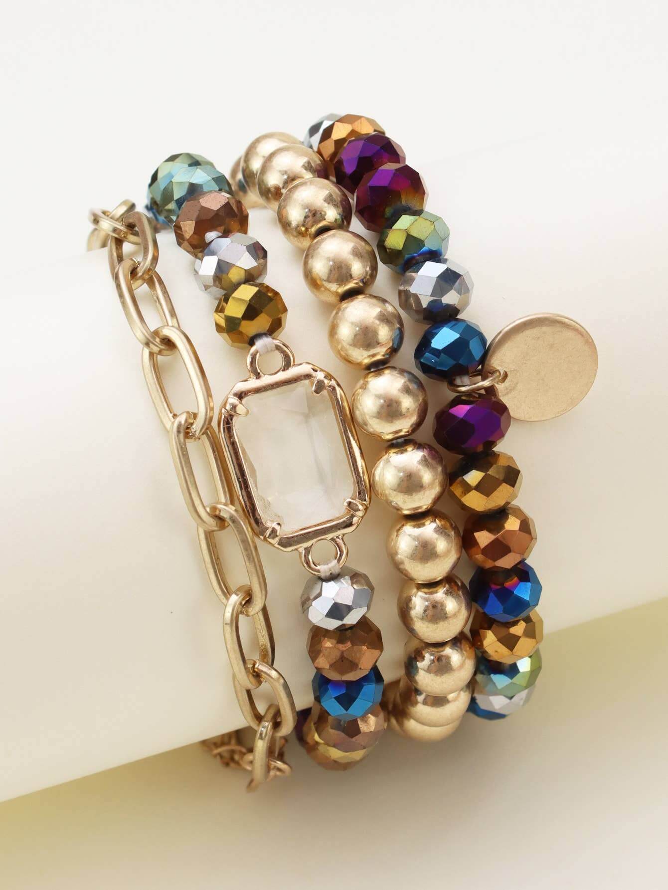 Prism Collection 4-piece bracelet set featuring colorful faceted beads and a metallic finish.