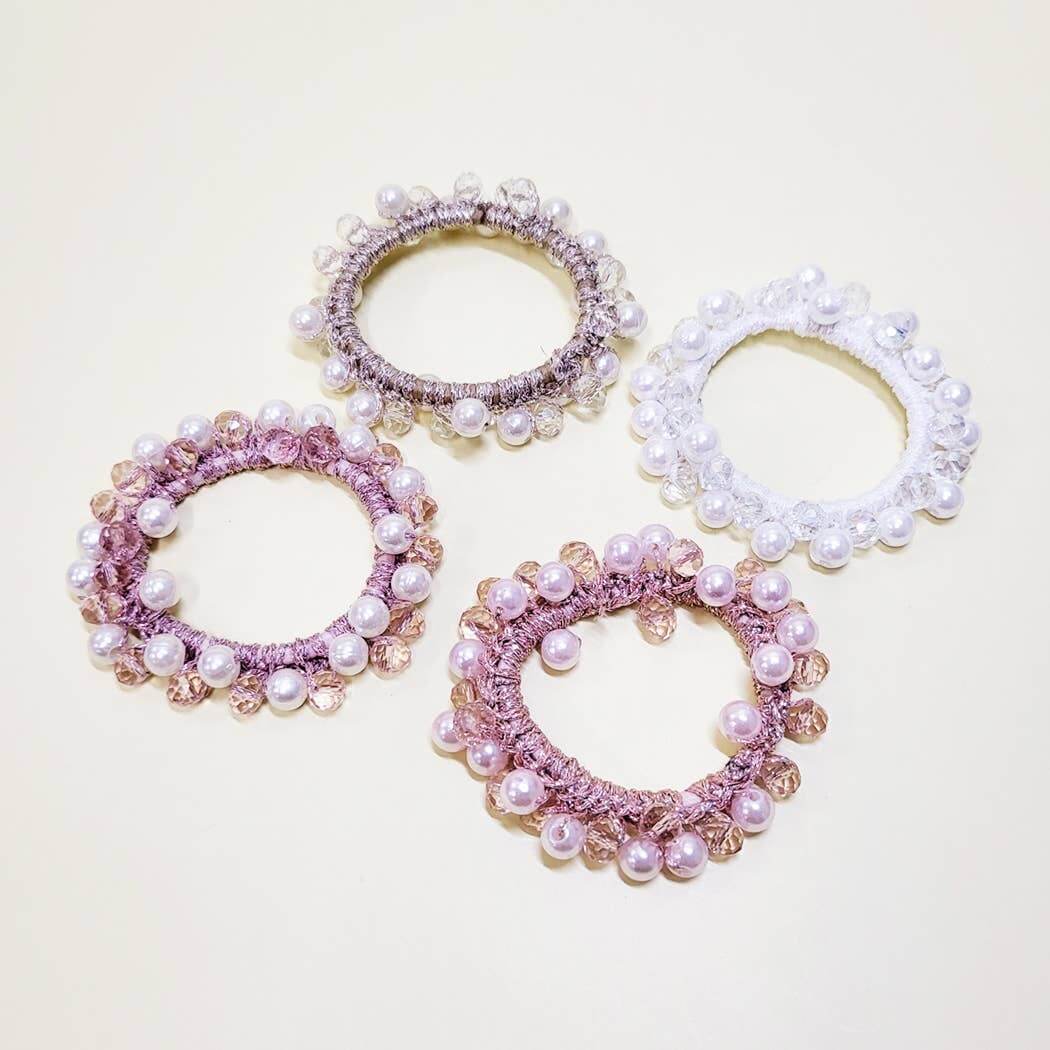 Charmed Twists Hair Ties by Superstar in pink and white with beads and faux pearls for a chic updo.