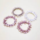 Charmed Twists Hair Ties by Superstar in pink and white with beads and faux pearls for a chic updo.