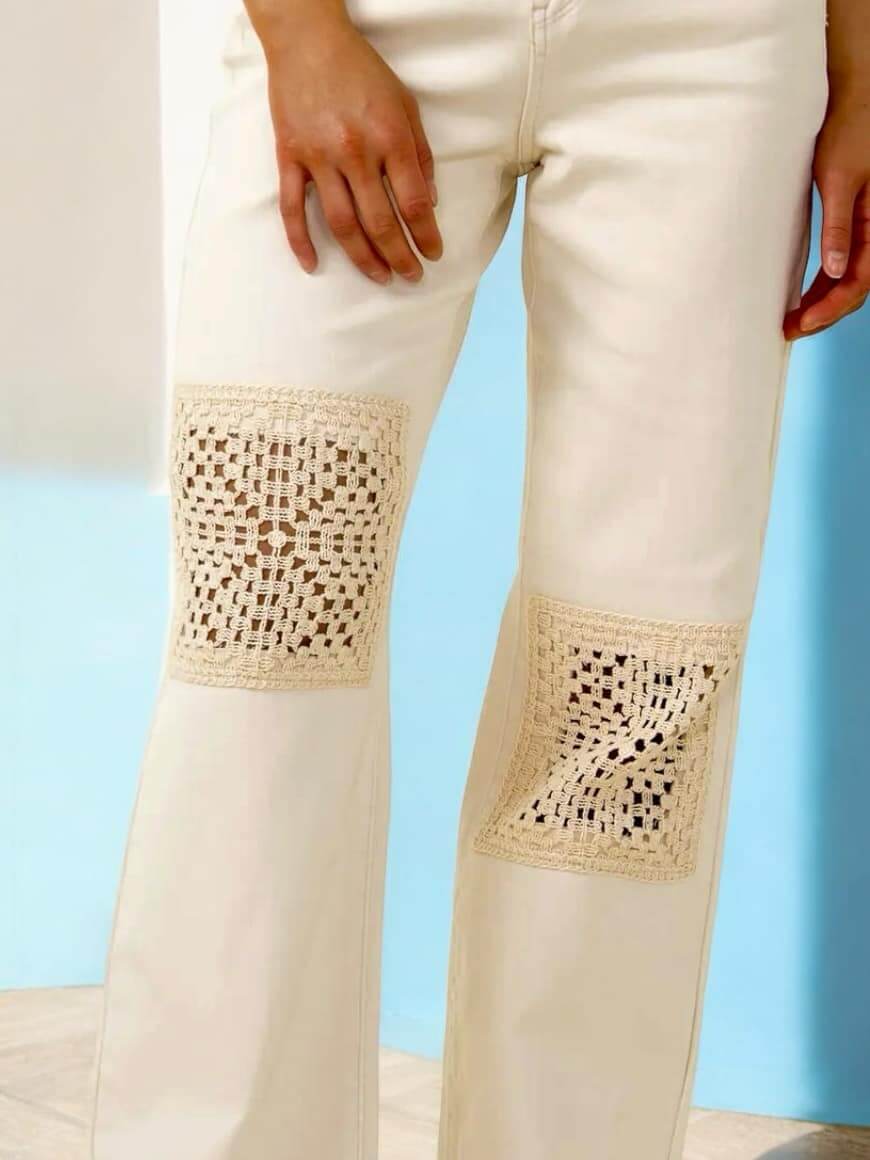 Judy Blue Valerie Jeans with crochet patches on ecru wide-leg denim, adding rustic charm to any outfit.