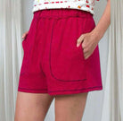 Women's ruby red shorts with pockets and elastic waist, perfect for lounging and casual wear.