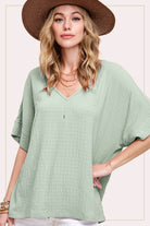 Thinking About You Top (Sage) – Trendy Boutique Blouse by La Miel $34.00 Discover comfort and style with our boutique sage blouse. Perfect loose fit with v-neckline and unique woven airflow design for a trendy, relaxed look. Teal Tiger Boutique