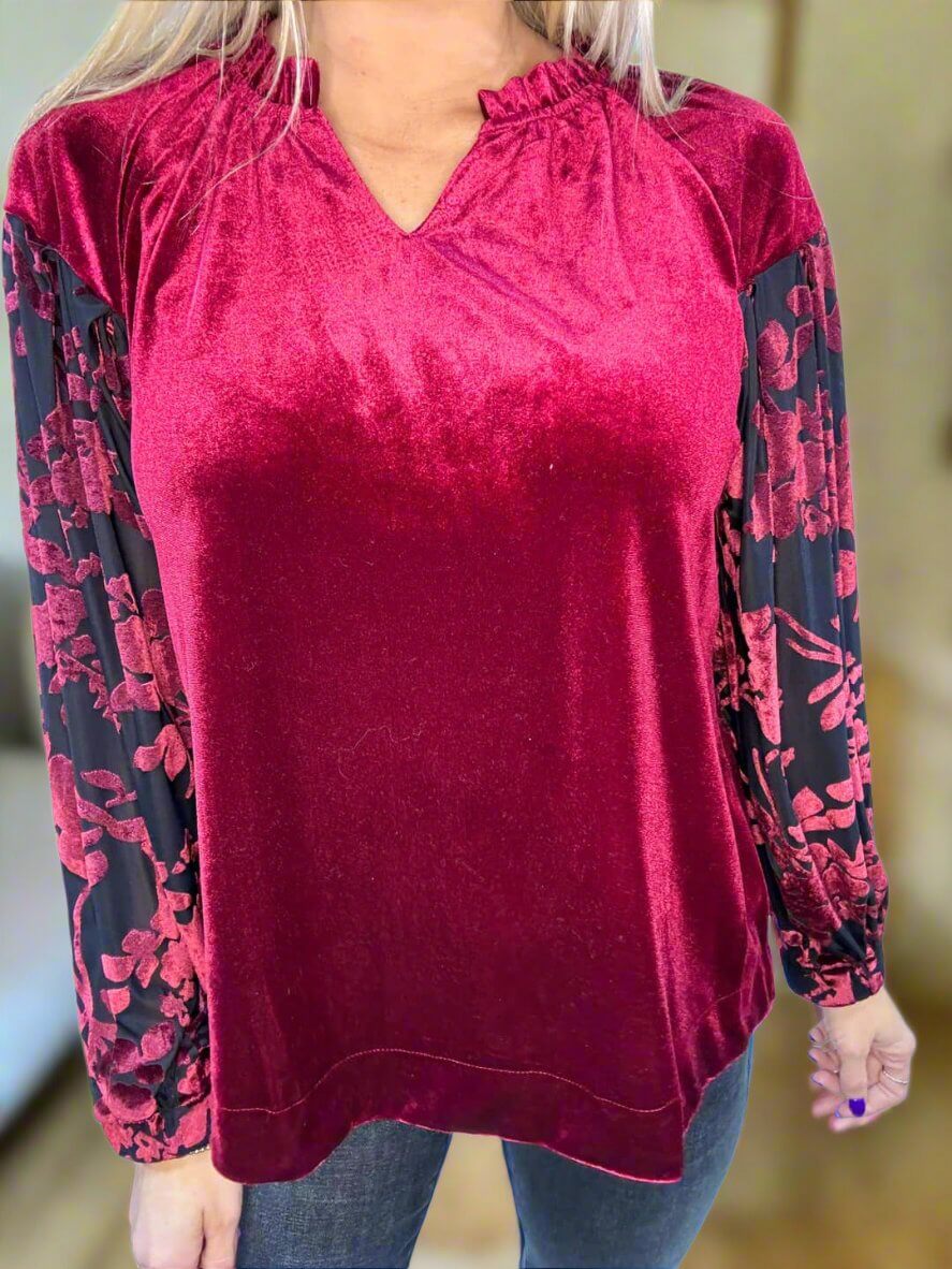 Burgundy velvet top with black lace sleeves, V-neck, ruffled collar, and elastic cuffs from Umgee.