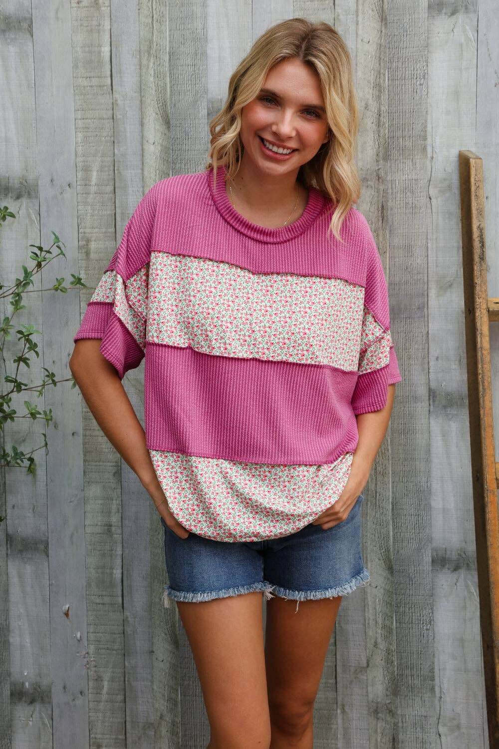 Casual chic weekend pullover in fuchsia floral and color block design, perfect for pairing with shorts.