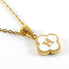 MONOGRAM MOMENTS NECKLACE with gold-plated pendant featuring initial 'H' on a delicate chain.
