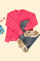 Oversized pink Flex Time Crew Neck sweater styled with jeans and trendy sneakers, perfect for a casual outfit.