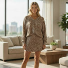 FIERCE COMFORT SKORT SET featuring a light French beige leopard print V-neck pullover and mini skirt set.