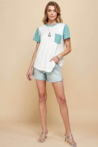Stylish women's short sleeve animal print contrast T-shirt, paired with denim shorts, perfect for casual outings.