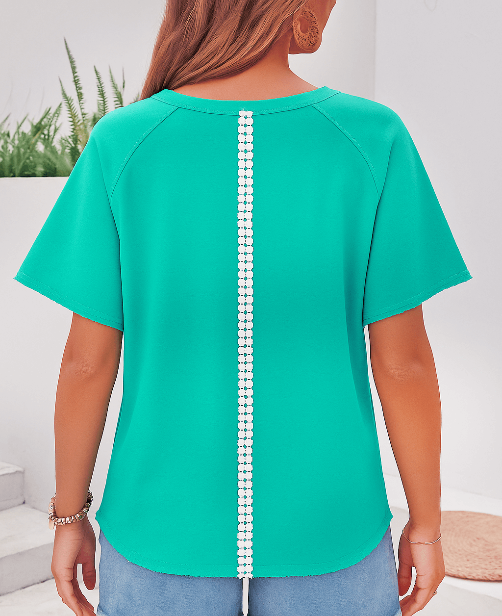 Teal Ribbon Theory Top showcasing lace bow detail and raw edge trim from the back angle, perfect for casual chic style.