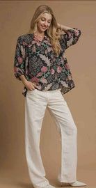Model wearing the FOREVERMORE TOP - Umgee with floral print, relaxed fit, and puff sleeves against a neutral background.