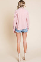 Women's embossed casual shacket in pink, featuring relaxed dolman sleeves and a classic collar, styled with denim shorts.