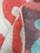 Close-up of the soft microfiber texture and vibrant colors of the Dixie Bella Heavenly Aire Throw Blanket.