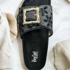 Black buckle eyelet slide sandals by Corkys, featuring a cushioned footbed and elegant design for summer style.