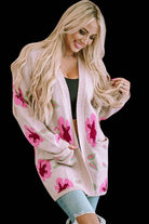 Woman wearing Cardi Girl Cardigan with floral pattern and drop shoulders, styled with jeans for a chic look.