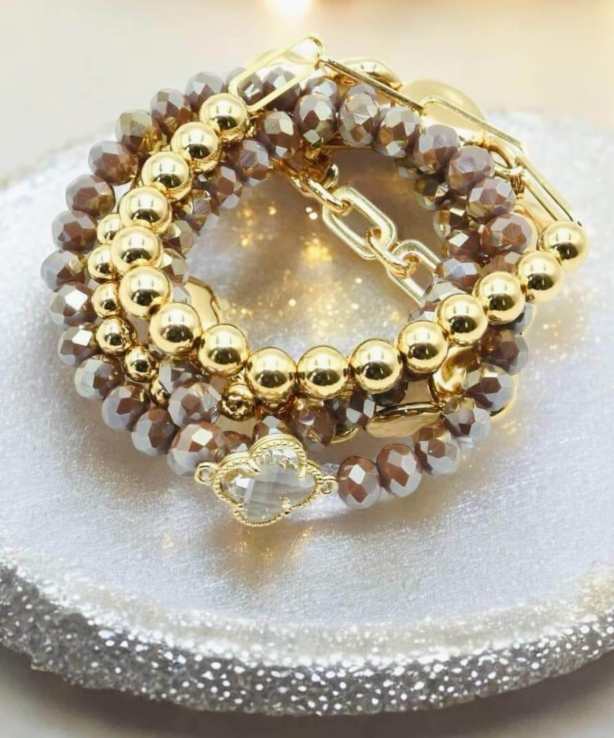 Serene Bracelet Set in taupe gray with gold-toned quatrefoil and faceted bead pieces by Nine Jewelry.