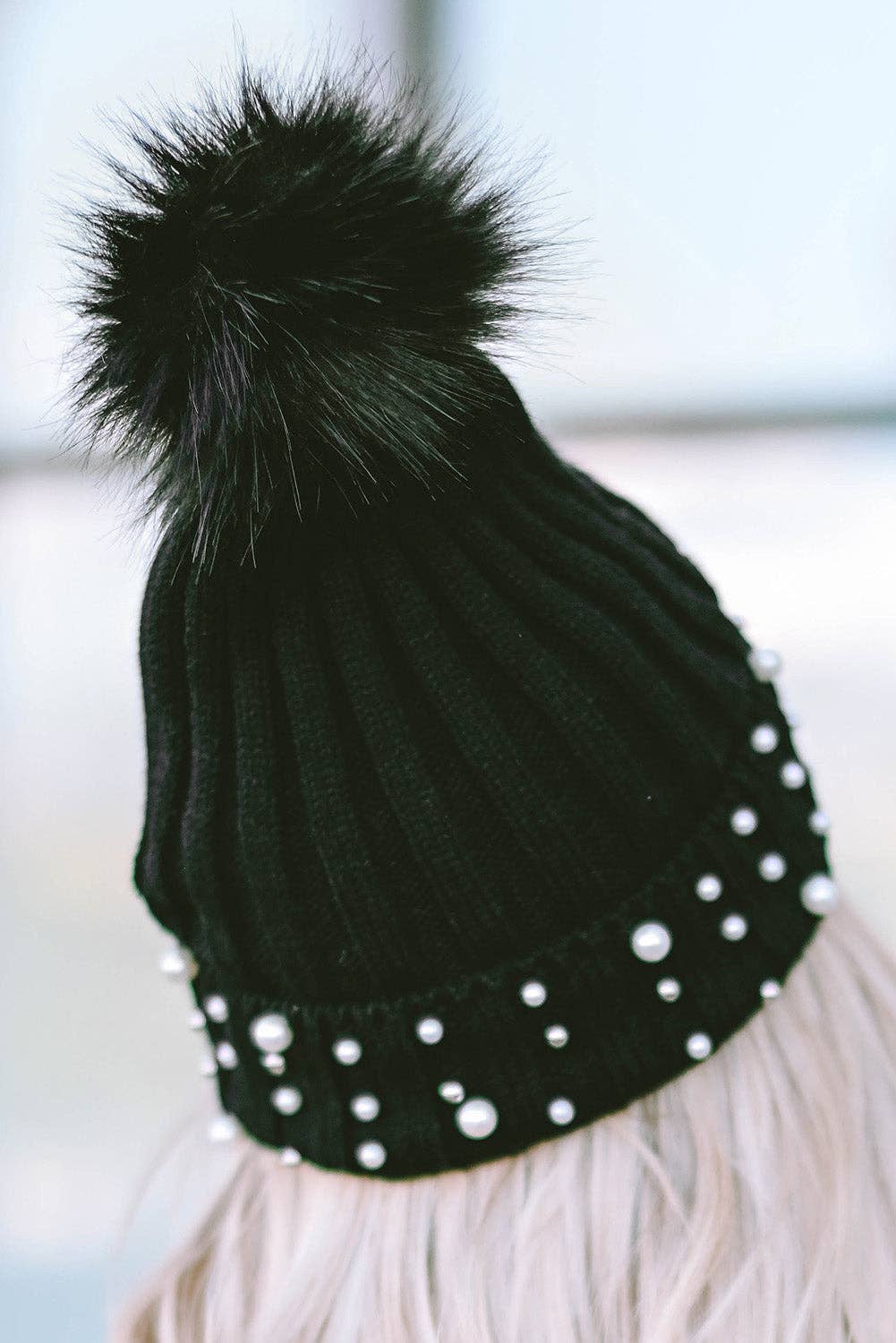 PEARL ESSENCE BEANIE by Lovesoft $10.00 Stunning pearl look beanie for a touch of elegance to any outfit. The playful pom pom adds a pop of fun and trendiness. The cuff design ensures a cozy and snug fit while the knit construction provides warmth and com