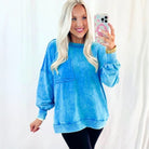 OCEAN MIST PULLOVER model showcasing a comfy blue mineral wash sweatshirt with a stylish pocket.