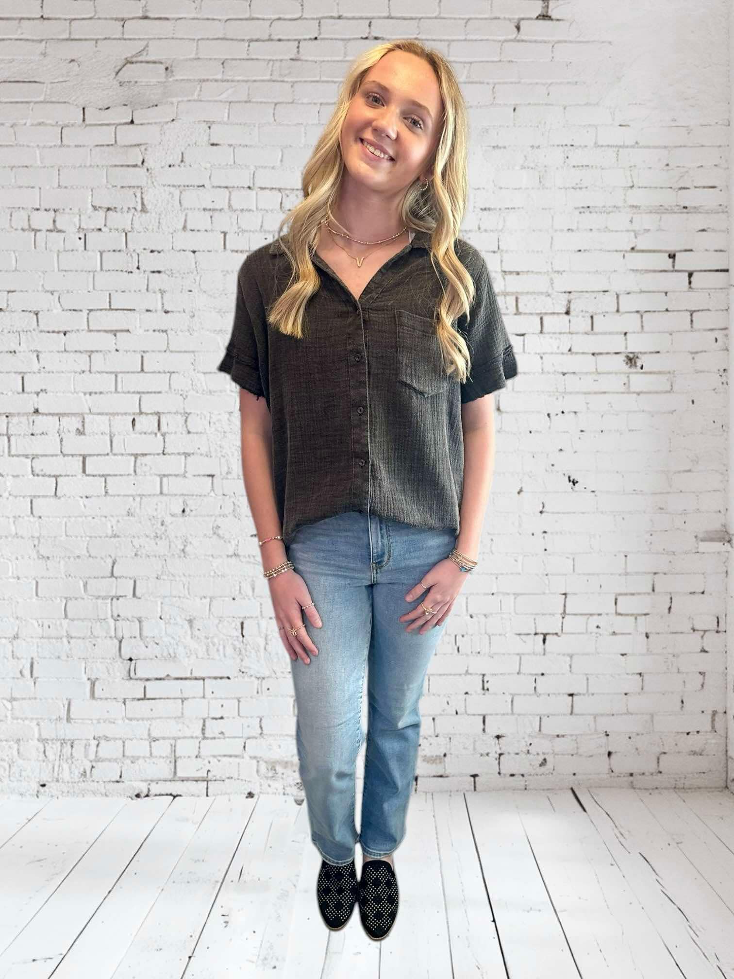 Model wearing the Midnight Mist top by Umgee, showcasing its casual style and playful design with frayed hem.