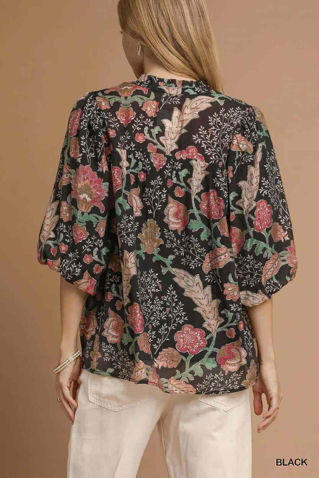 Back view of the FOREVERMORE TOP - Umgee with floral print and puff sleeves on a model.