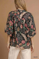 Back view of the FOREVERMORE TOP - Umgee with floral print and puff sleeves on a model.
