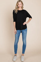 Model wearing Girlfriend Crew - BomBom in black with blue jeans, showcasing cozy, stylish look.