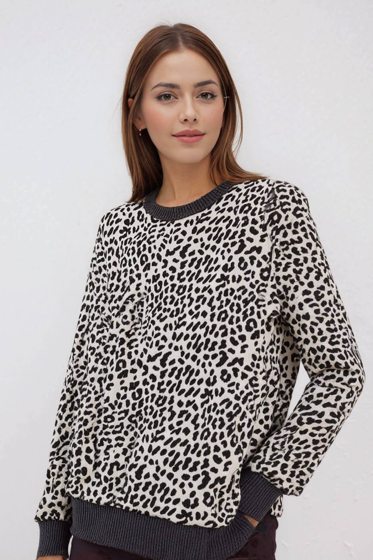 THE PERFECT SPOT Ribbed Top featuring a model in snow leopard print, perfect for chic everyday style.