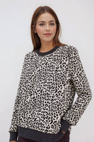 THE PERFECT SPOT Ribbed Top featuring a model in snow leopard print, perfect for chic everyday style.