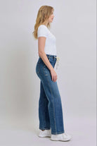 Model wearing JUDY BLUE Sophie Jeans with a high waist and wide-leg fit, styled with a simple white top and sneakers.