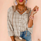 DRIFTWOOD DAYS BUTTON DOWN in khaki checkered print, featuring a hood and relaxed fit, perfect for layered outfits.